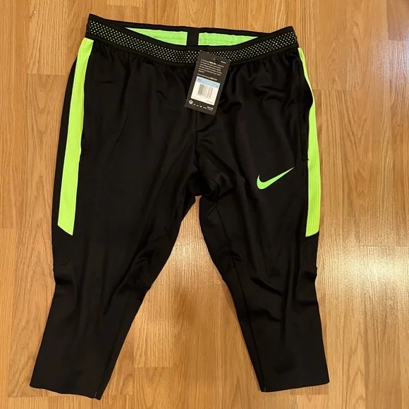 Nike Dri-Fit Men’s knee length legging/black w neon green/zippered side pockets. - Picture 1 of 3
